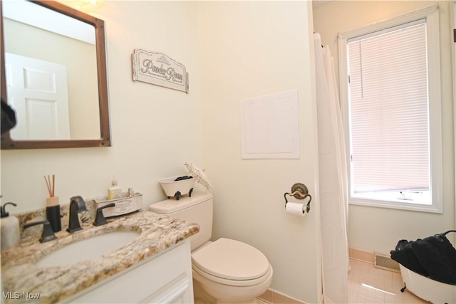 full bathroom with toilet, visible vents, tile patterned flooring, and vanity