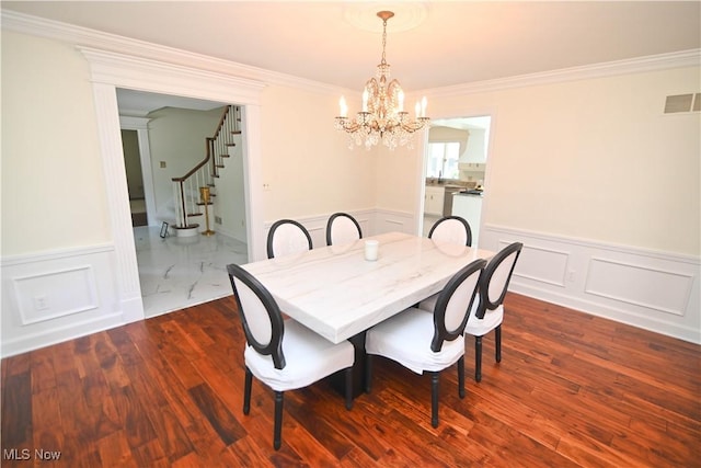 dining area with dark wood-style floors, visible vents, crown molding, and stairs