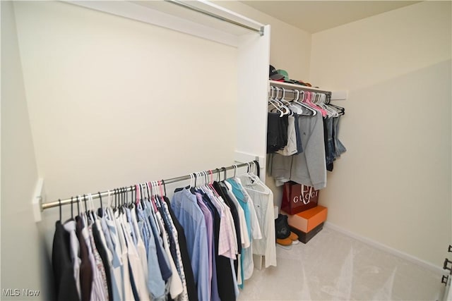 walk in closet featuring carpet floors