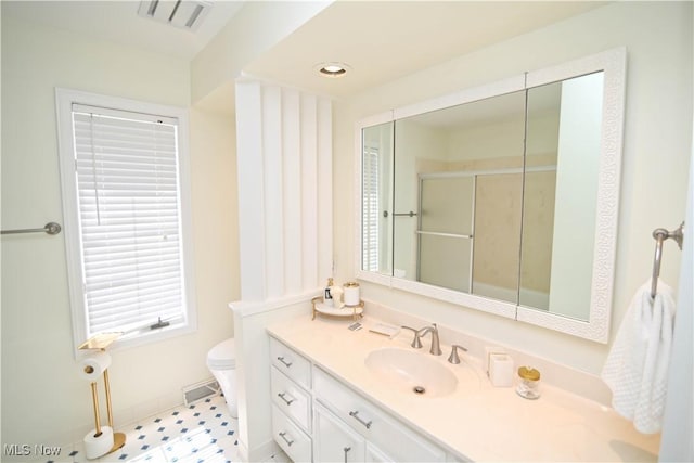 bathroom with recessed lighting, visible vents, toilet, a stall shower, and vanity