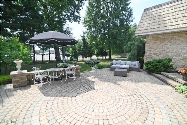 view of patio / terrace featuring outdoor dining space and outdoor lounge area