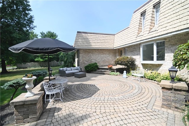 view of patio / terrace featuring fence and an outdoor hangout area