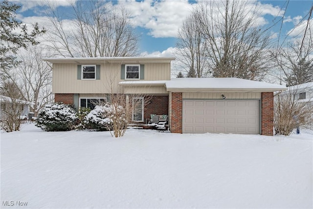 view of front of home featuring a garage and brick siding