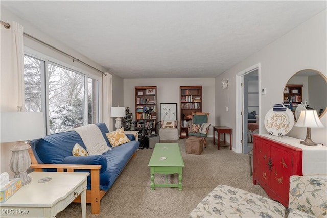 living room with light carpet, arched walkways, and baseboards