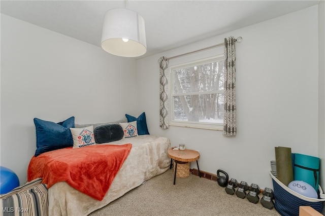 carpeted bedroom featuring baseboards