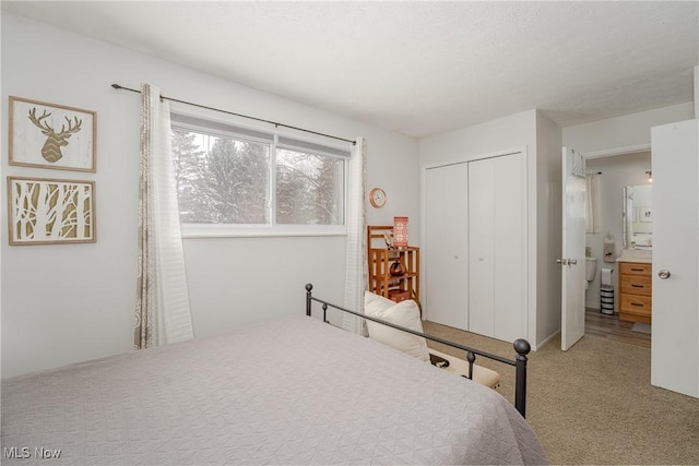 carpeted bedroom featuring a closet