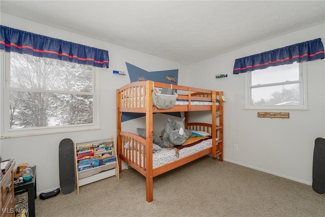 bedroom featuring carpet floors and baseboards