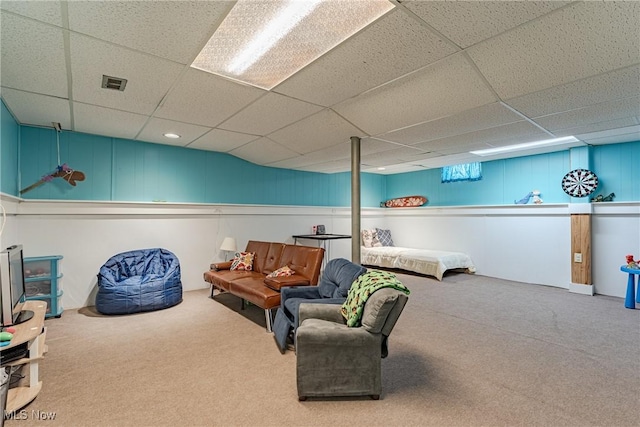 interior space featuring carpet, visible vents, and a paneled ceiling