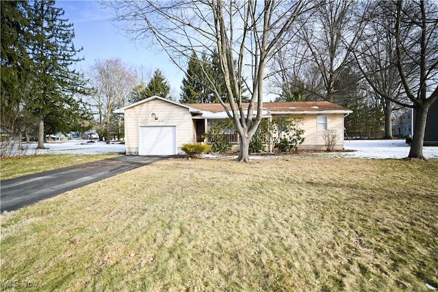 ranch-style house with a garage, driveway, and a front lawn