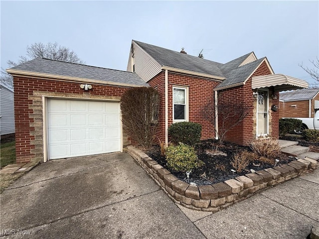 view of home's exterior with a garage, brick siding, driveway, and roof with shingles