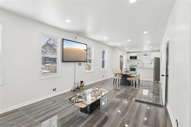 dining area with a healthy amount of sunlight, baseboards, and recessed lighting