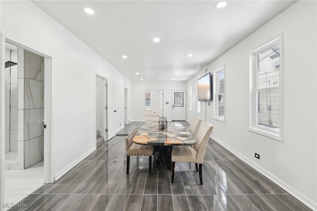 dining area with baseboards and recessed lighting