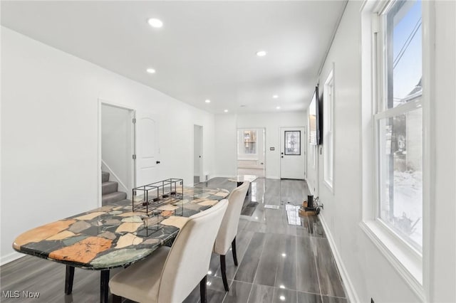 dining area featuring stairs, dark wood-style flooring, baseboards, and recessed lighting