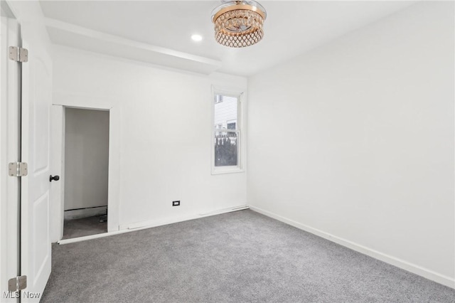 unfurnished bedroom featuring baseboards and carpet flooring