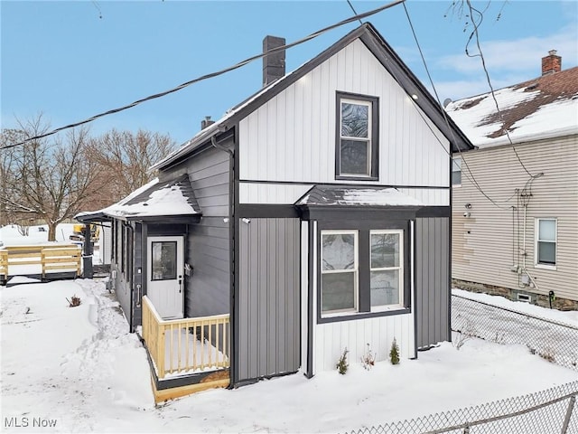 view of front of house featuring a chimney and board and batten siding