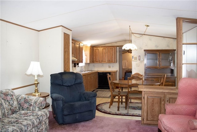 carpeted living area featuring ornamental molding, vaulted ceiling, and a sink