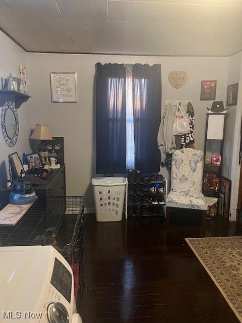 interior space featuring wood finished floors and washer / dryer