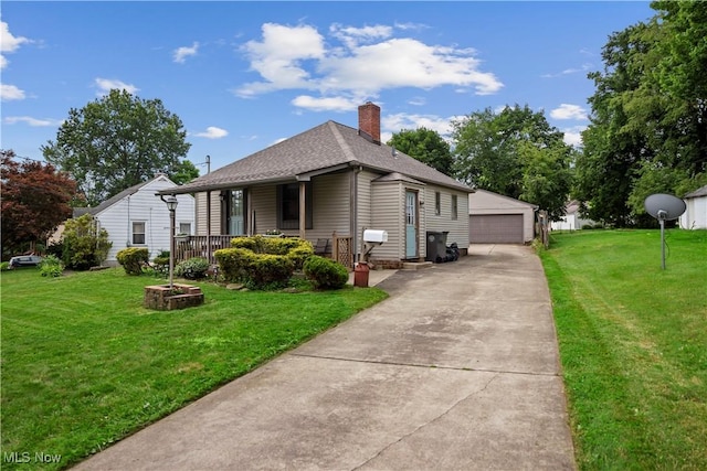 view of front of house with a garage, a chimney, roof with shingles, an outbuilding, and a front lawn