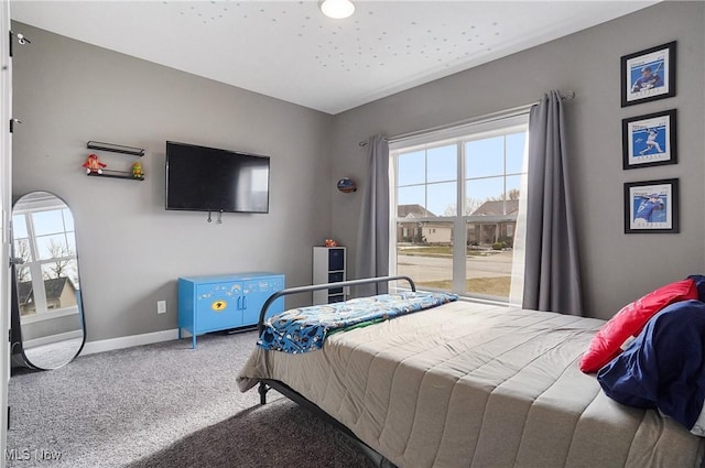 carpeted bedroom with baseboards