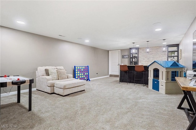 interior space featuring carpet, baseboards, a bar, and recessed lighting