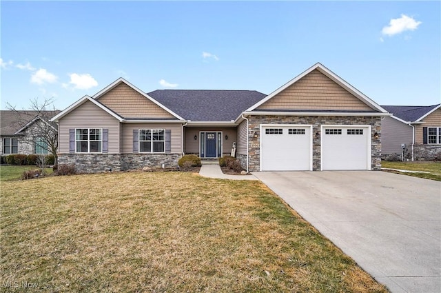 craftsman-style home with a garage, a front yard, concrete driveway, and stone siding