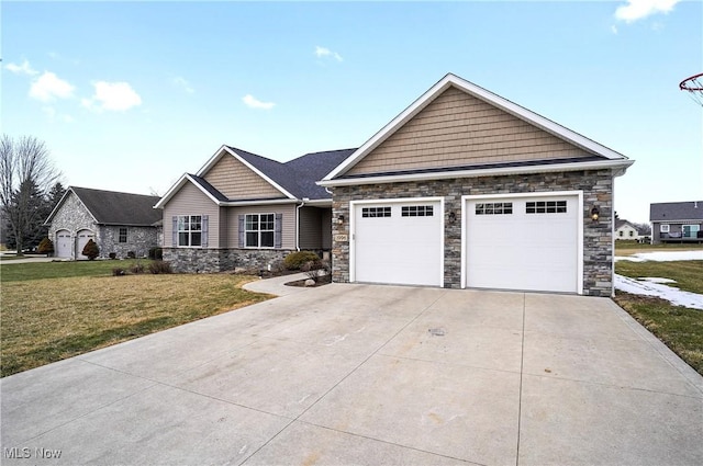 view of front facade featuring stone siding, a front yard, concrete driveway, and an attached garage