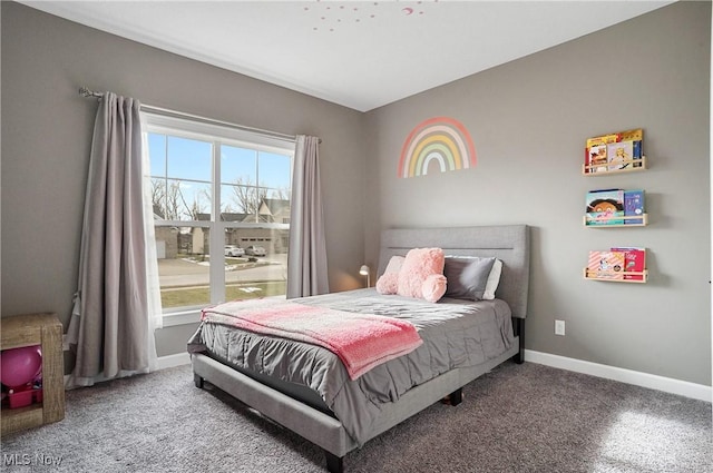 bedroom featuring carpet floors and baseboards