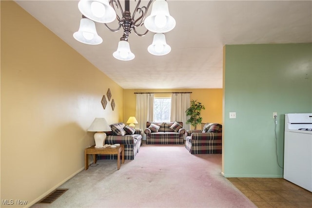 living room featuring carpet floors, visible vents, baseboards, and an inviting chandelier