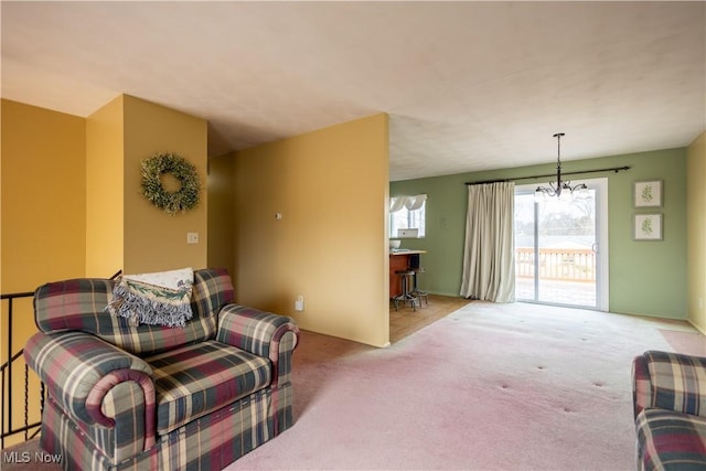 living area with light colored carpet and a notable chandelier