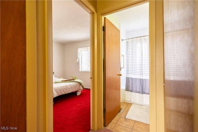 corridor with light tile patterned floors