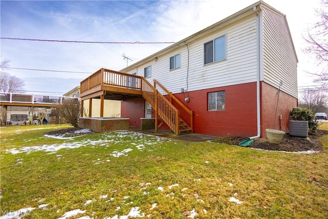 back of house featuring a deck, central AC, stairway, and a lawn