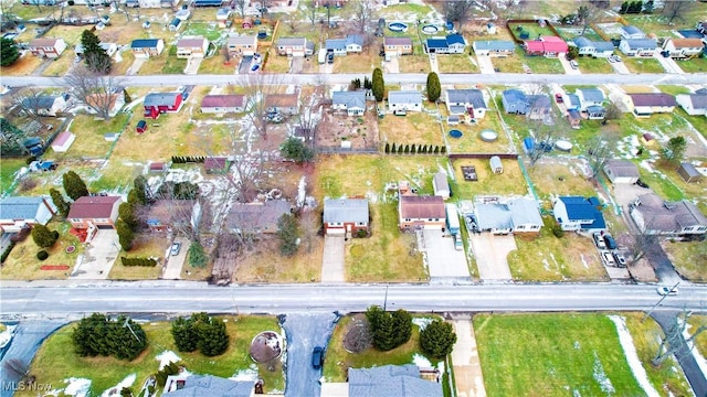 birds eye view of property with a residential view