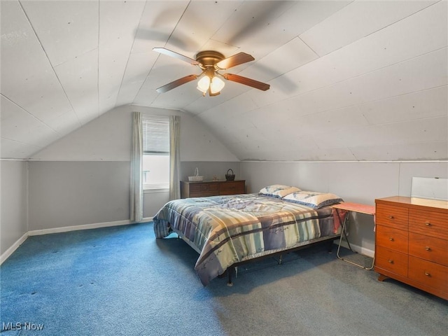 bedroom featuring a ceiling fan, carpet, vaulted ceiling, and baseboards