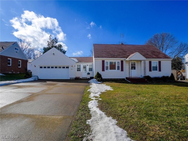 view of front of home featuring a garage, concrete driveway, and a front lawn