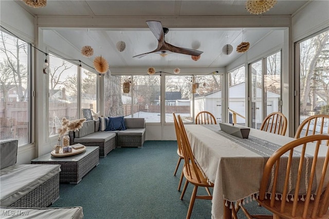 sunroom with a ceiling fan