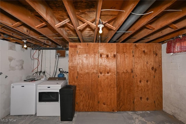 unfinished basement featuring separate washer and dryer