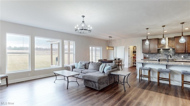 living room with dark wood-style flooring, recessed lighting, visible vents, a chandelier, and baseboards