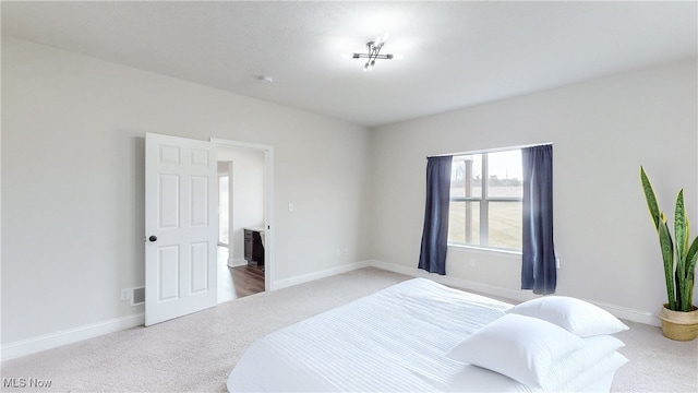 bedroom featuring carpet, visible vents, and baseboards