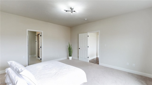 carpeted bedroom with baseboards