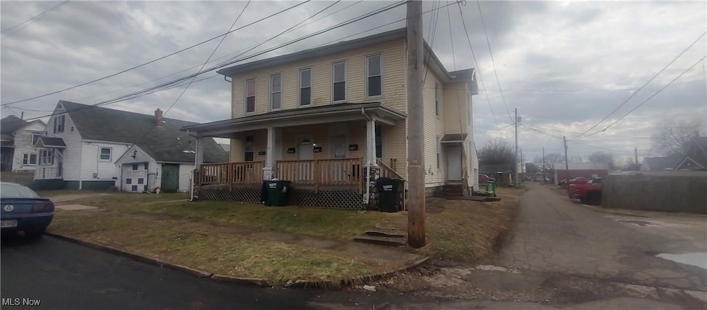 view of front of home featuring a residential view and covered porch