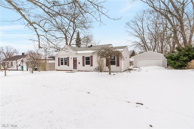 view of front of house with a detached garage and an outdoor structure