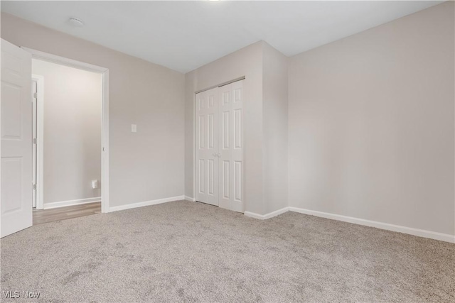1893 Benjamin Rd, Madison, OH 44057 - unfurnished bedroom featuring carpet flooring, baseboards, and a closet