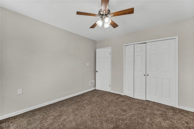 unfurnished bedroom featuring carpet floors, a closet, a ceiling fan, and baseboards