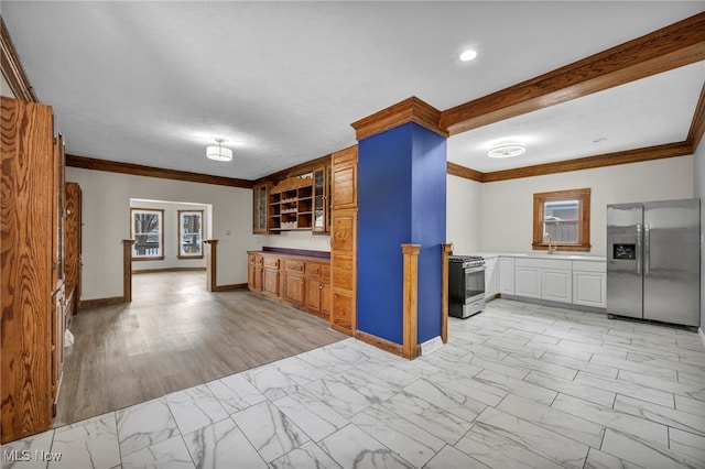 kitchen with appliances with stainless steel finishes, marble finish floor, crown molding, open shelves, and a sink