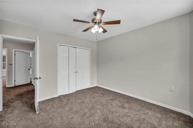 unfurnished bedroom featuring carpet, a closet, and baseboards