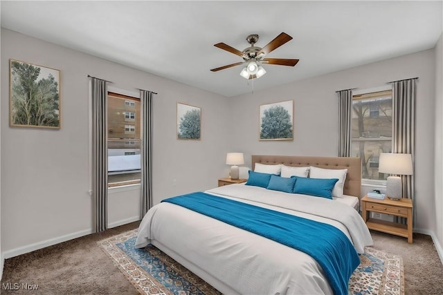 carpeted bedroom featuring ceiling fan and baseboards