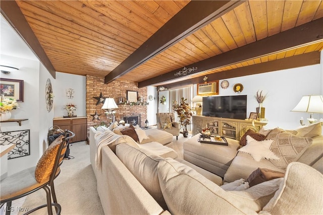 living area featuring light carpet, beamed ceiling, a brick fireplace, and wooden ceiling