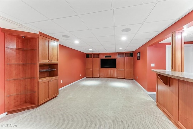 unfurnished living room featuring baseboards, recessed lighting, and light colored carpet