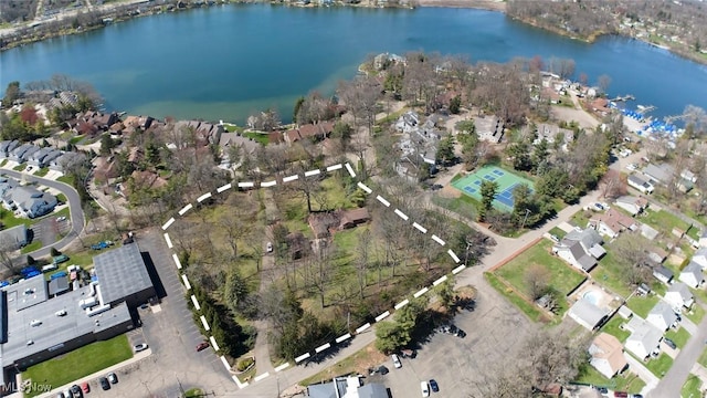 birds eye view of property with a water view and a residential view