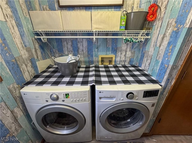 laundry room with laundry area and washing machine and clothes dryer